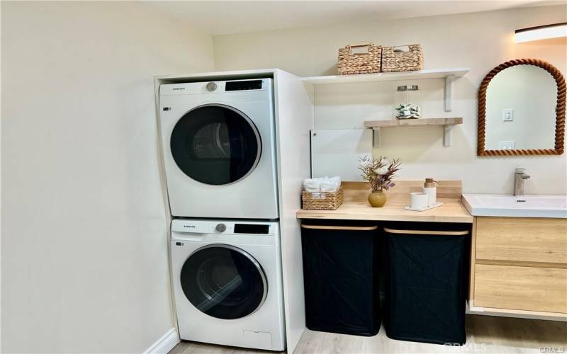 Full size stacked washer/dryer.