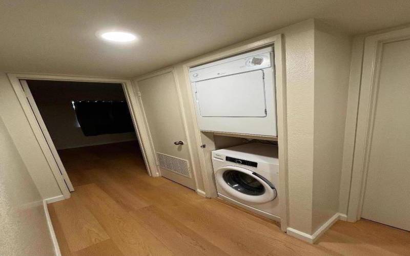 Hallway  with washer and new dryer