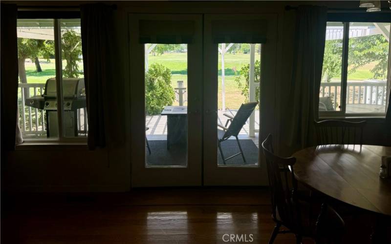 Dining area with oak hardwood floors looking out to rear deck.