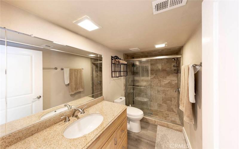 Guest bathroom with full shower. Beautifully upgraded.