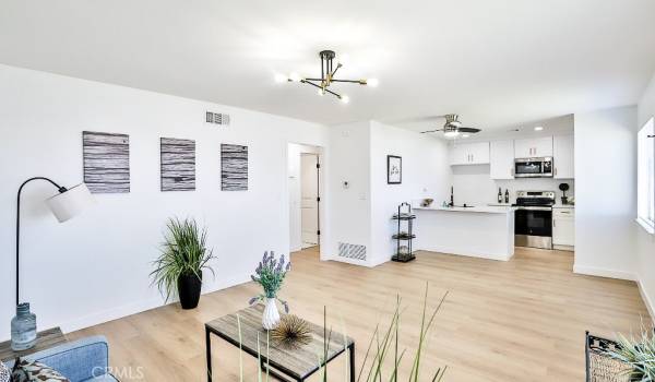 Living room open to dining and kitchen