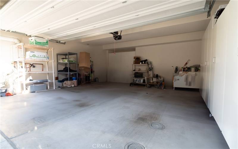 Spacious garage with custom cabinet storage