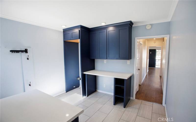 Laundry area with built in cabinetry