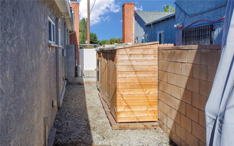 Side yard with sheds