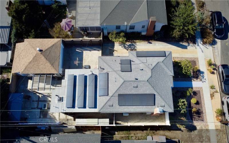 Aerial view of home featuring solar panels