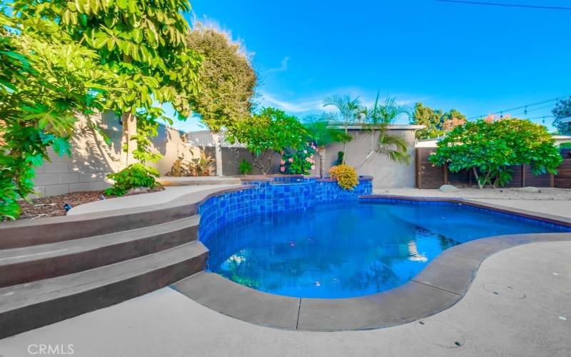 Spa waterfalls into the pool