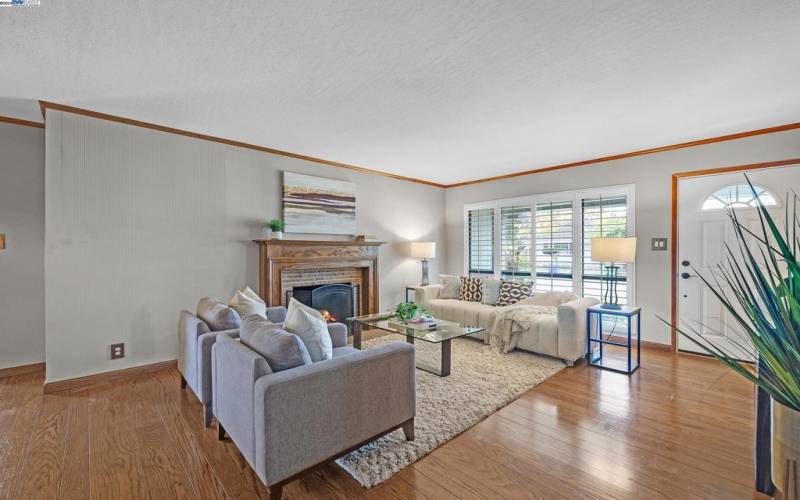 Bright, spacious living room with cozy fireplace