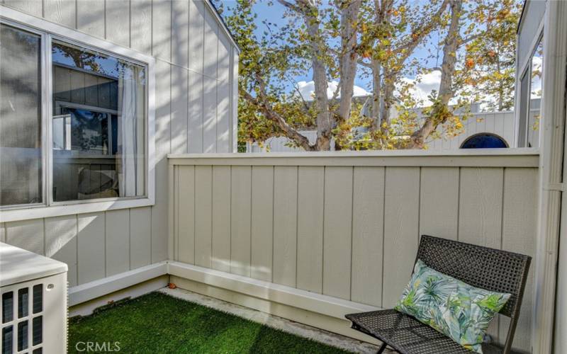 Private peaceful balcony accessed by sliding doors in hallway outside of Primary bedroom