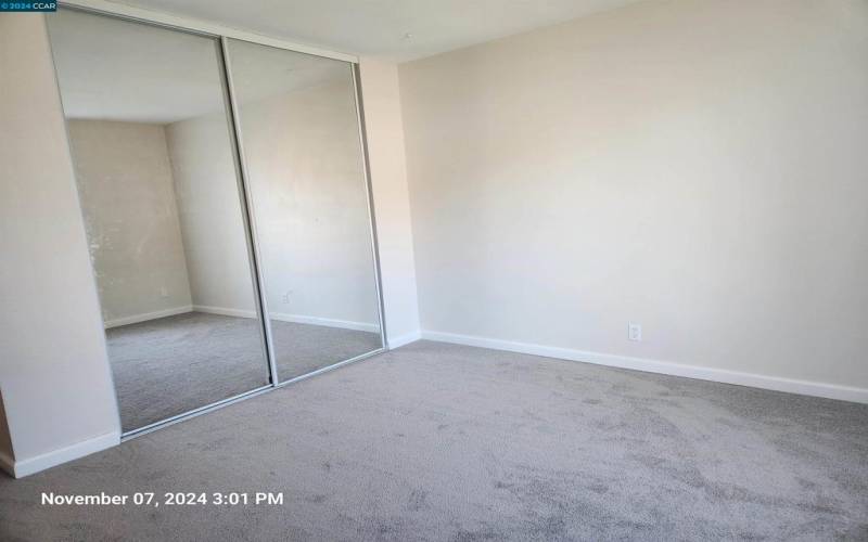 Both secondary bedrooms have large closets with mirrored closet doors