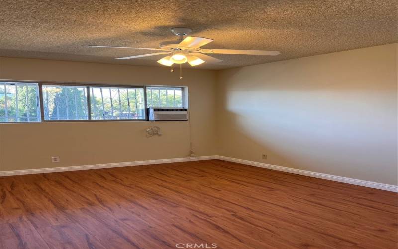 Bedroom with A/C and fan