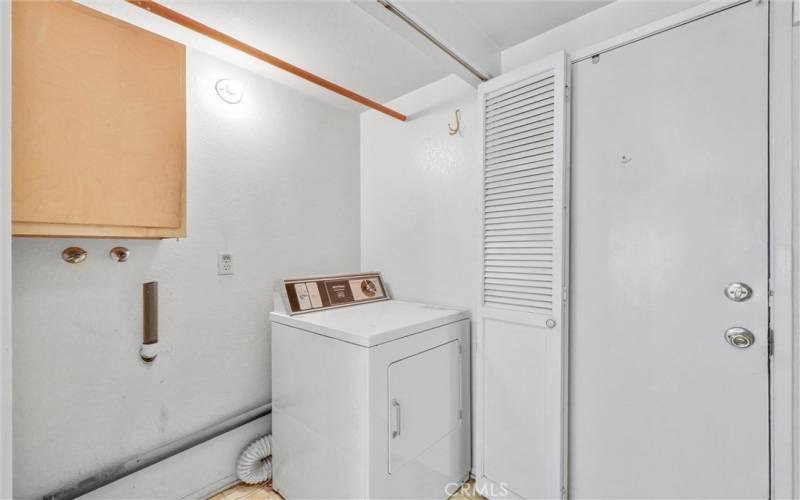 Laundry room area located on the first floor near kitchen