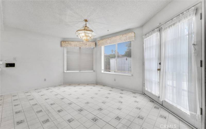 Diining room with french doors to backyard.