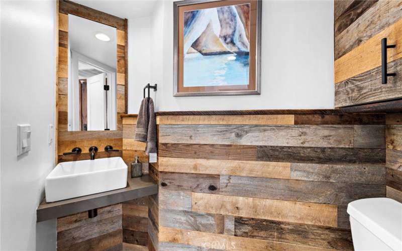 Powder bath on first floor conveniently located off entry for guest access