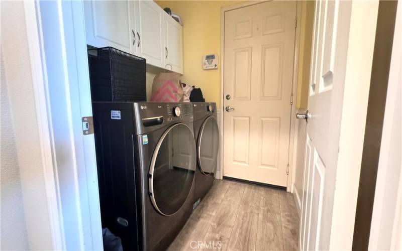 Downstairs laundry room with doors open to garage