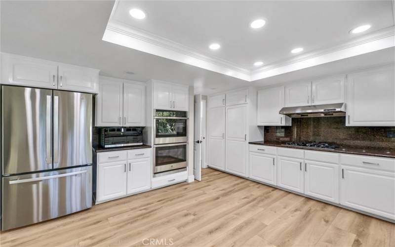 Upgraded stainless appliances, complete with double oven