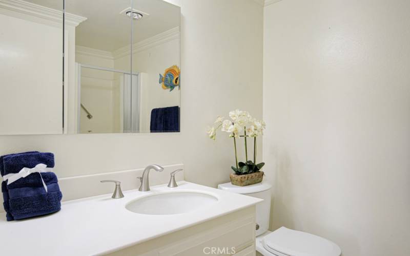 Pretty guest bathroom is just across the hall from the guest bedroom.