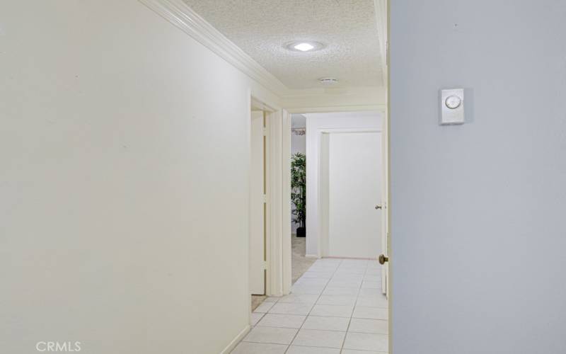 The hallway leads to the bedrooms and bathrooms.