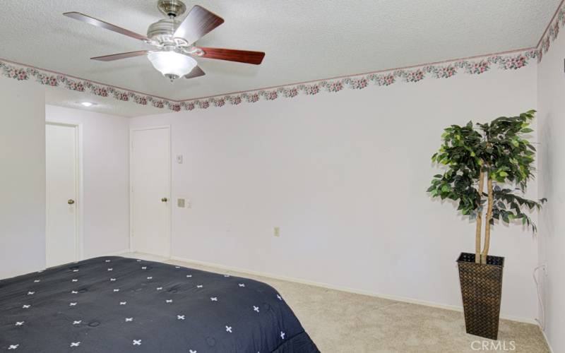 Another view of the primary bedroom shows the spaciousness of the room.  It will accommodate even large pieces of furniture.