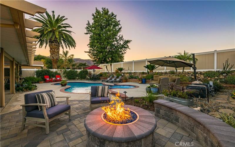 Firepit sitting area over pavers