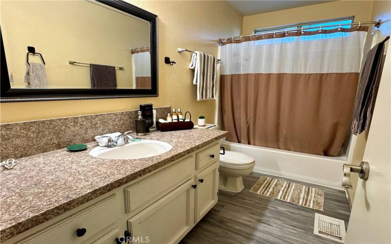 Upstairs full bath with new laminate flooring