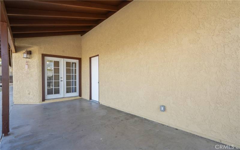 Covered patio leading from kitchen dining area