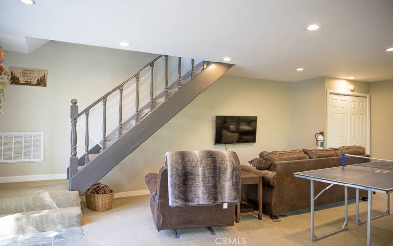 Downstairs couch, recliner, & flat screen