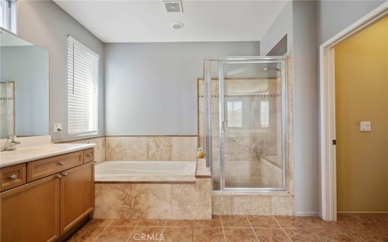 Primary Bathroom, soaking tub and separate glass shower & separate toilet area