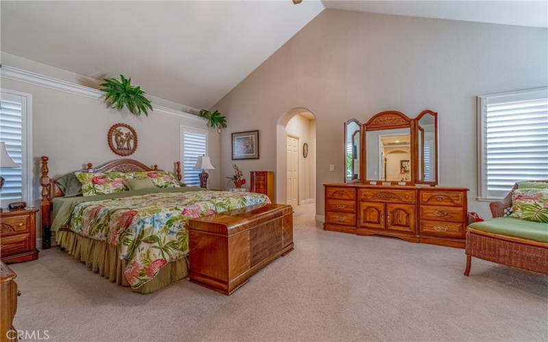 Master Bedroom with Sitting area next to fireplace, and sliding door for access to pool