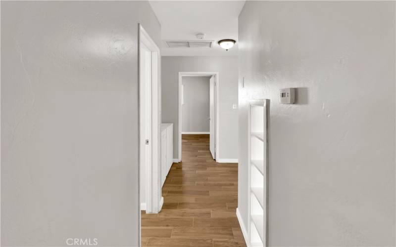 Hallway leading to both bedrooms