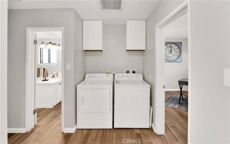 Laundry area with storage space