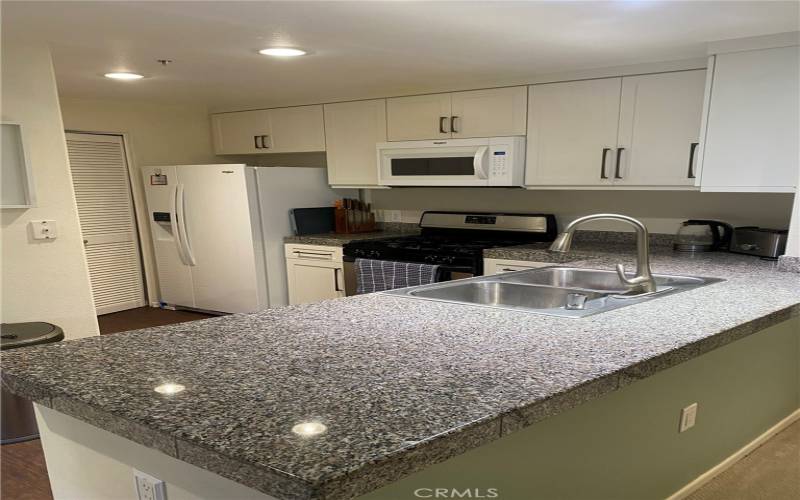 Another view of kitchen looking towards the laundry room.