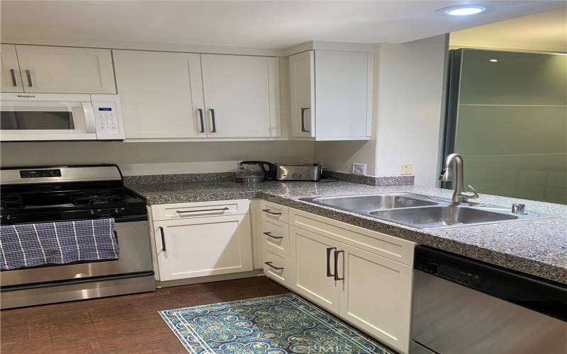 Updated kitchen, soft close cabinets and granite counter tops.