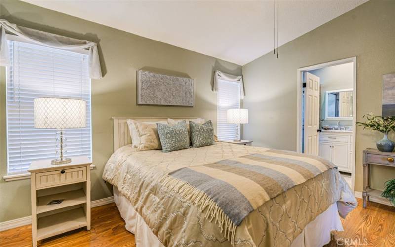 The vaulted ceilings and generous size create an inviting sense of space in this bedroom, making it a perfect retreat.