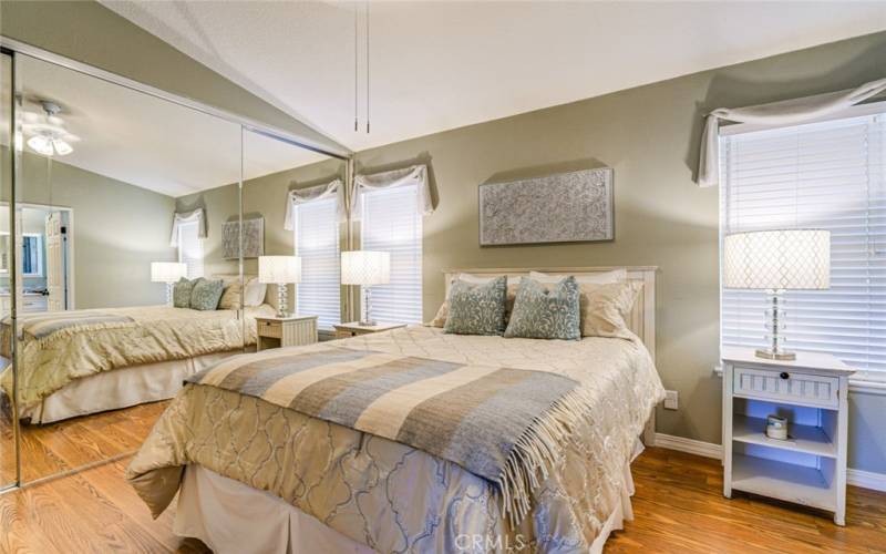 The mirrored wardrobe enhances the sense of openness in this room.