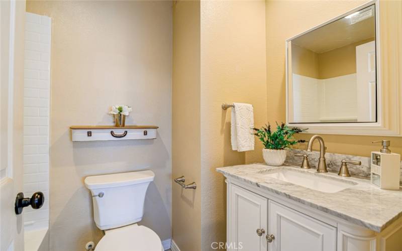 This bathroom has been beautifully upgraded as well and has a tub/shower combo.