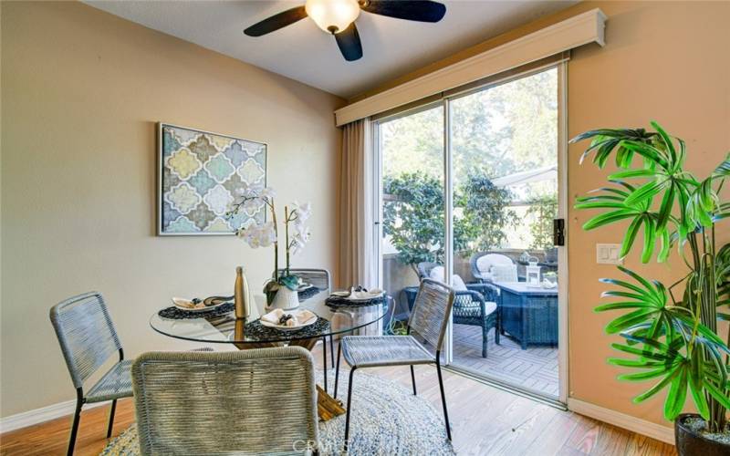 Step out from the dining area to a quaint patio setting.