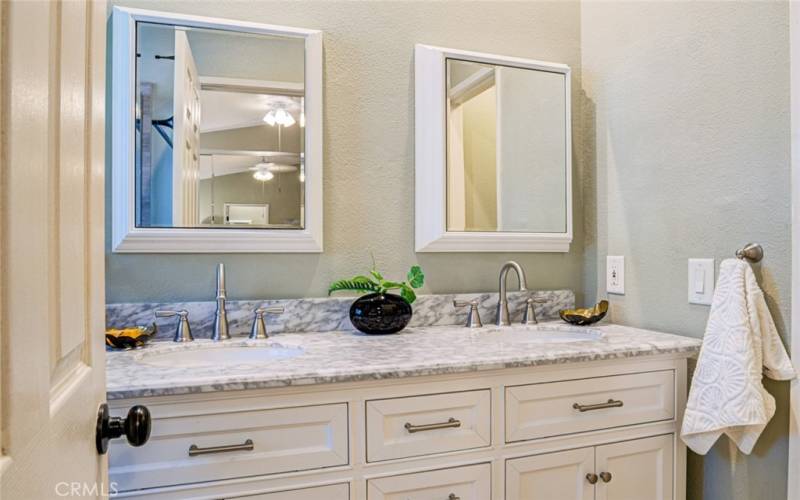 This beautiful bathroom features the convenience of dual sinks.