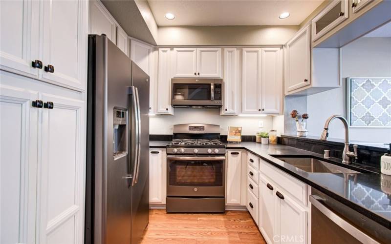 You will find ample cupboard space, tasteful granite countertops, upgraded hardware and soft-closed drawers.