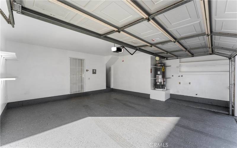 Two car garage with gas water heater and brand new garage door opener. Newly pained with beautiful epoxy flooring.