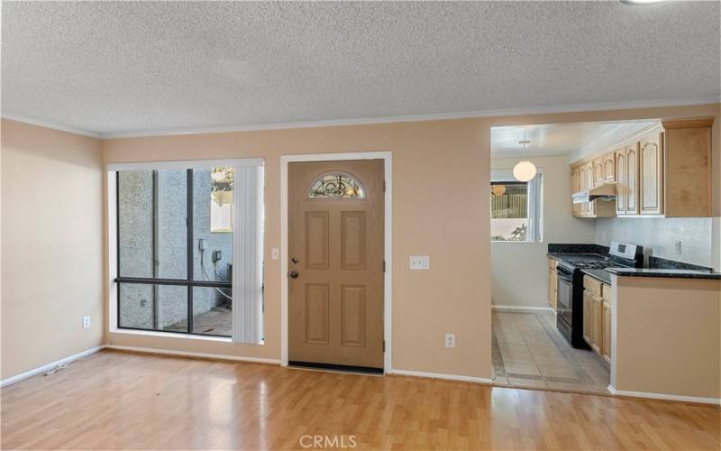 Main entrance and large window with brand new blinds