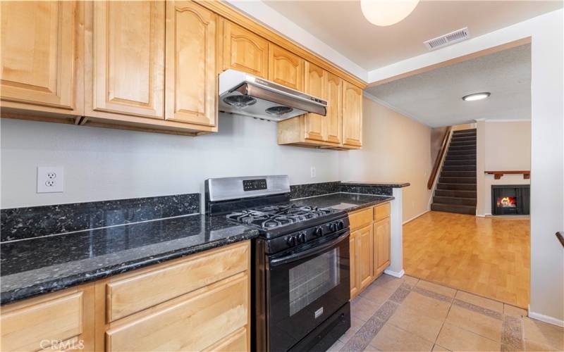 Gas range with exhaust. Beautiful cabinets.