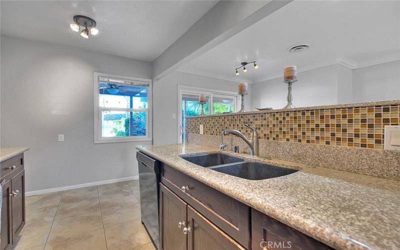 Granite counters and tiled backsplash