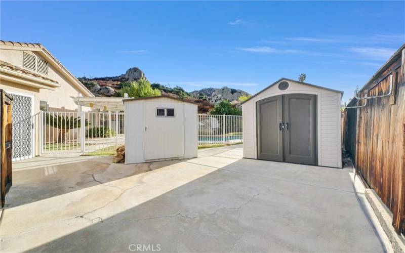 RV parking area with storage sheds.