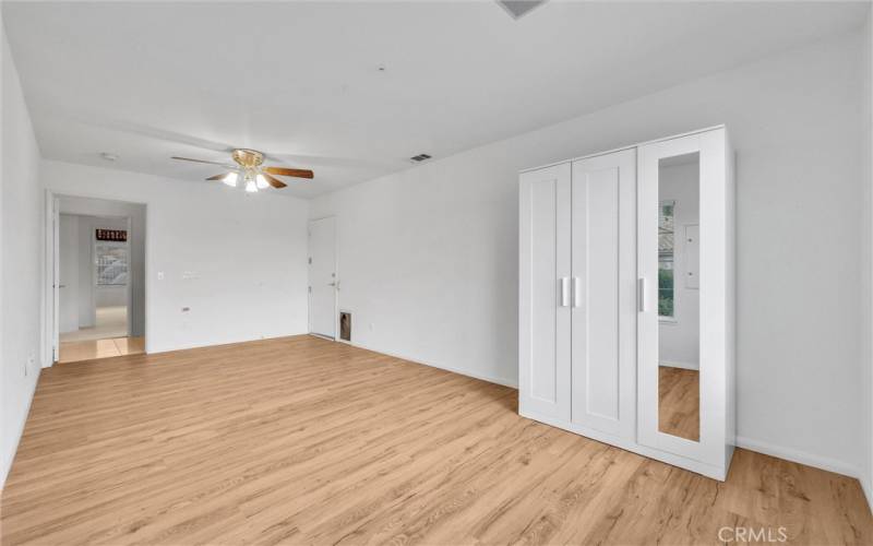 Bedroom #3 with laminate flooring and ceiling fan.