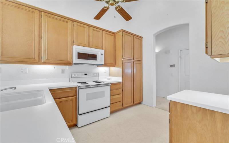 Kitchen with ceiling fan and plenty of cabinets