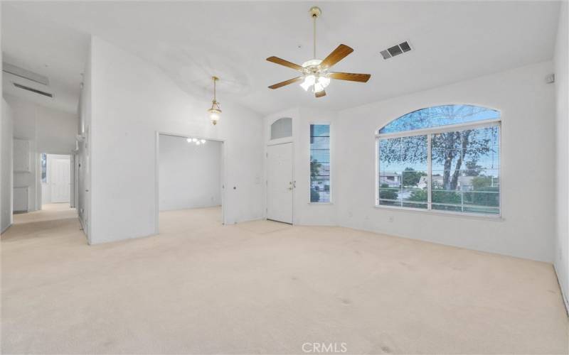 Entry to home with living room and den area.