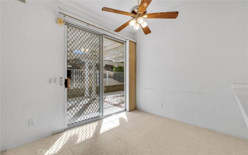 Kitchen dining area with sliding glass door leading to the patio.