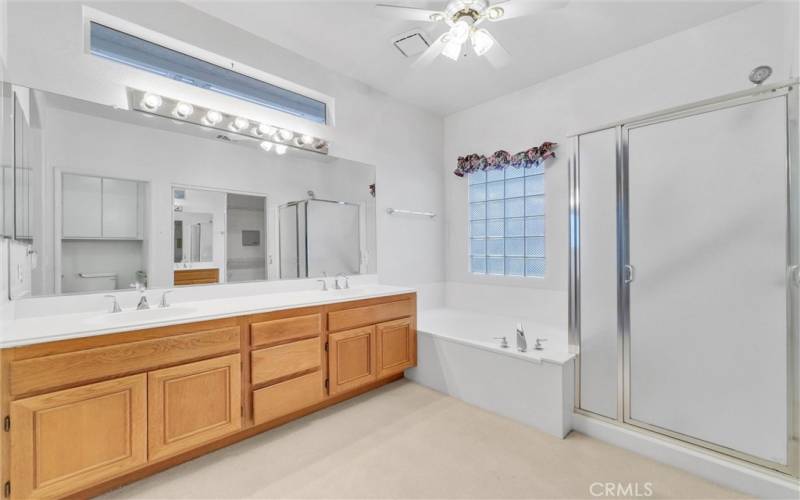 Master bath with dual sinks, soaking whirlpool tub and separate shower.