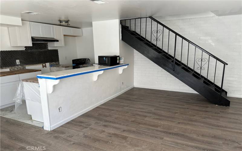 Kitchen Partially Completed New Floors Throughout