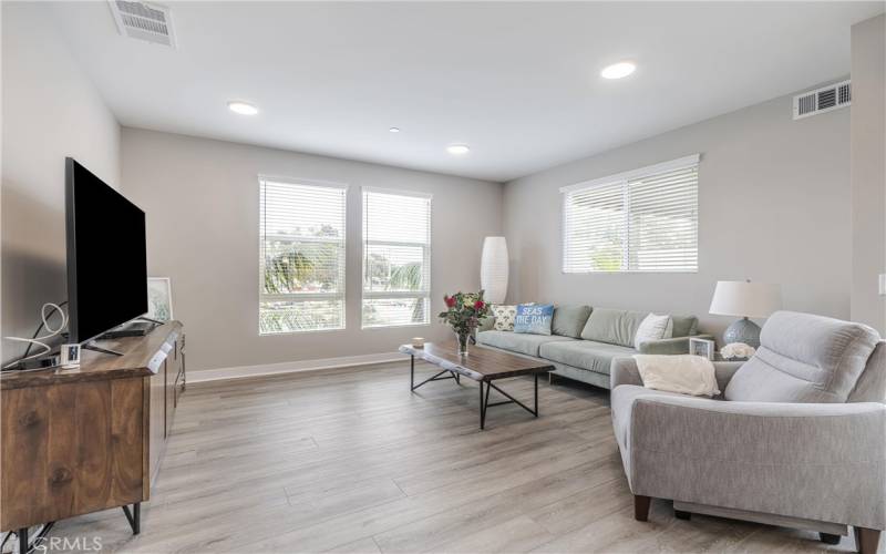 Great room w/recessed lighting and laminate floors